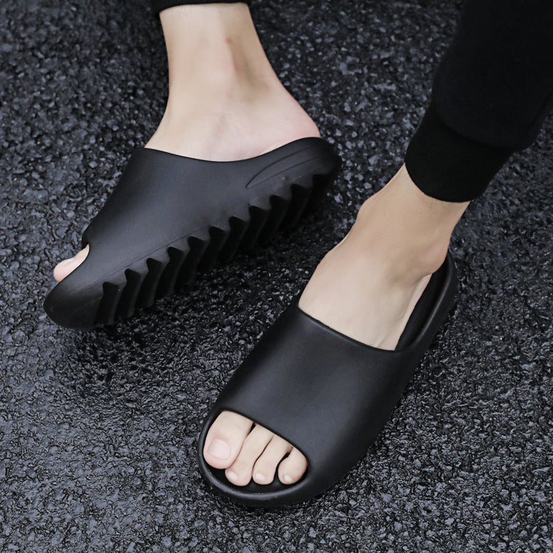 Black foam slide sandal lifestyle image